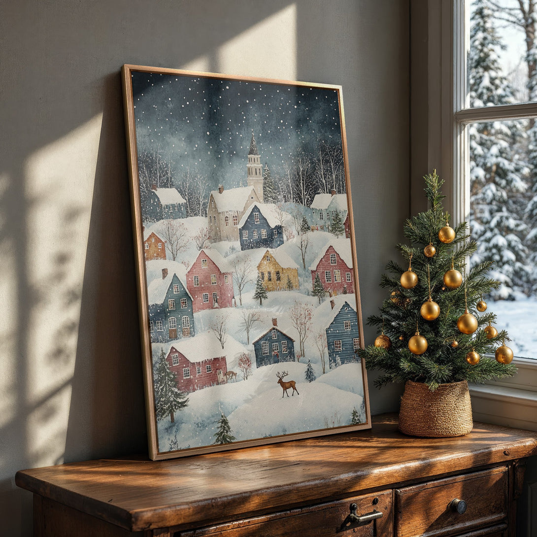 Framed Wall Art: Watercolor winter village scene with snow-covered houses. Warm, inviting color palette. Perfect for cozy home decor.