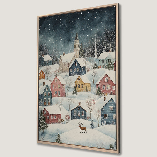 Framed Wall Art featuring a charming winter village scene with colorful houses and a deer. Watercolor style art with a serene, snowy landscape and a calming blue and pastel color palette.