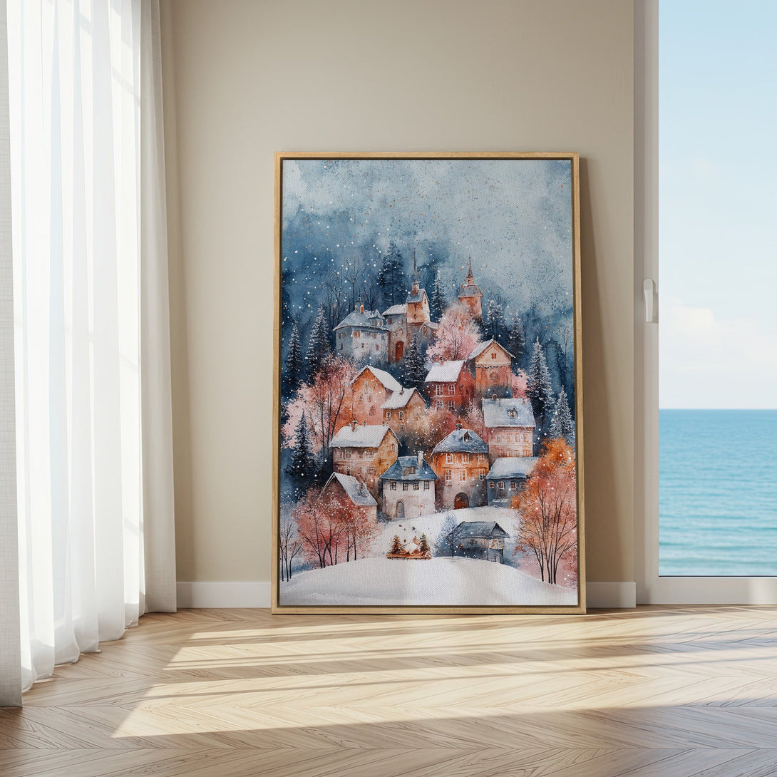 Framed Wall Art: Watercolor winter village scene with blue, orange, and pink hues. Perfect for cozy home decor. Add warmth to your space!