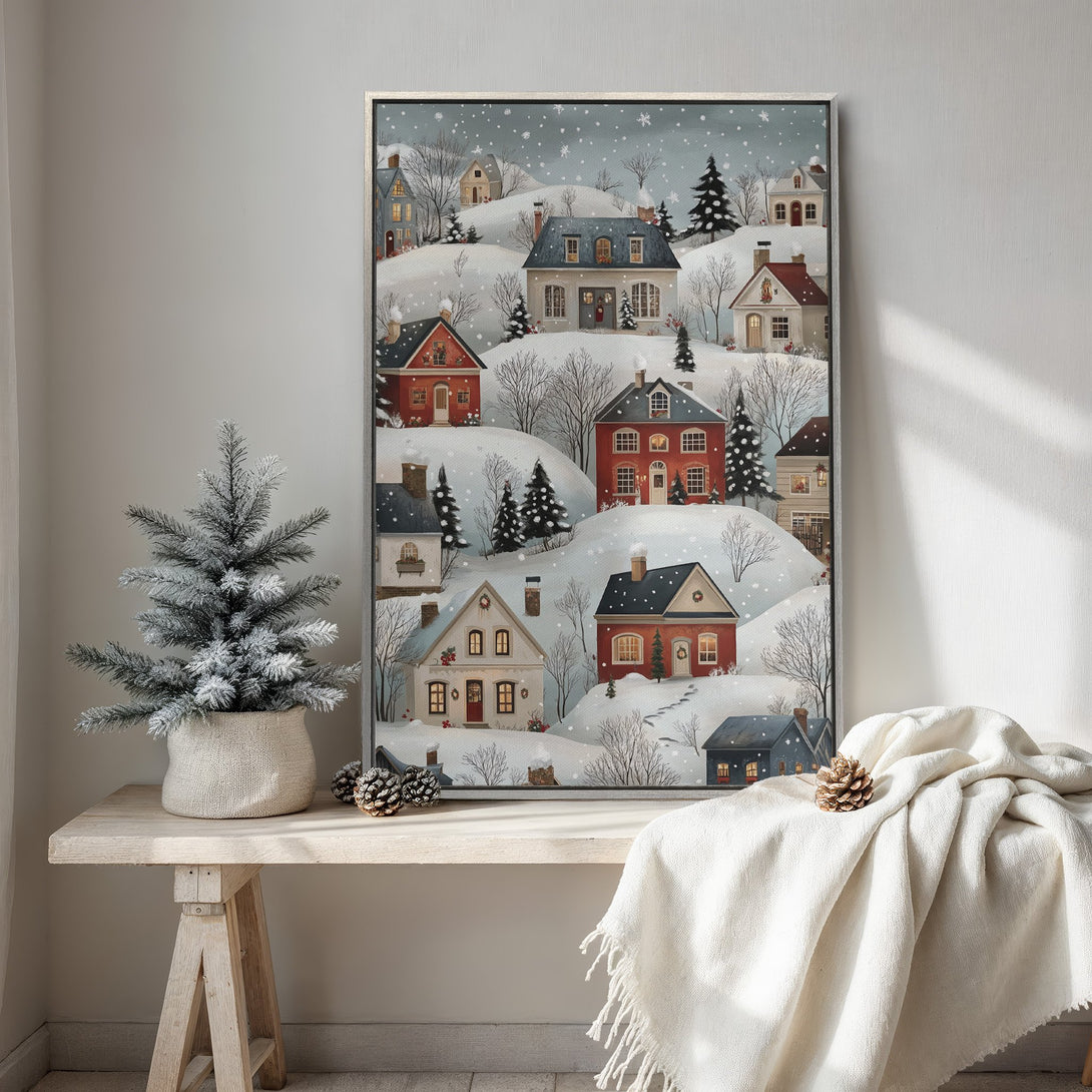 Framed Wall Art of a cozy winter village scene in a charming, whimsical style with a soft, muted color palette. Perfect for adding warmth to your home.