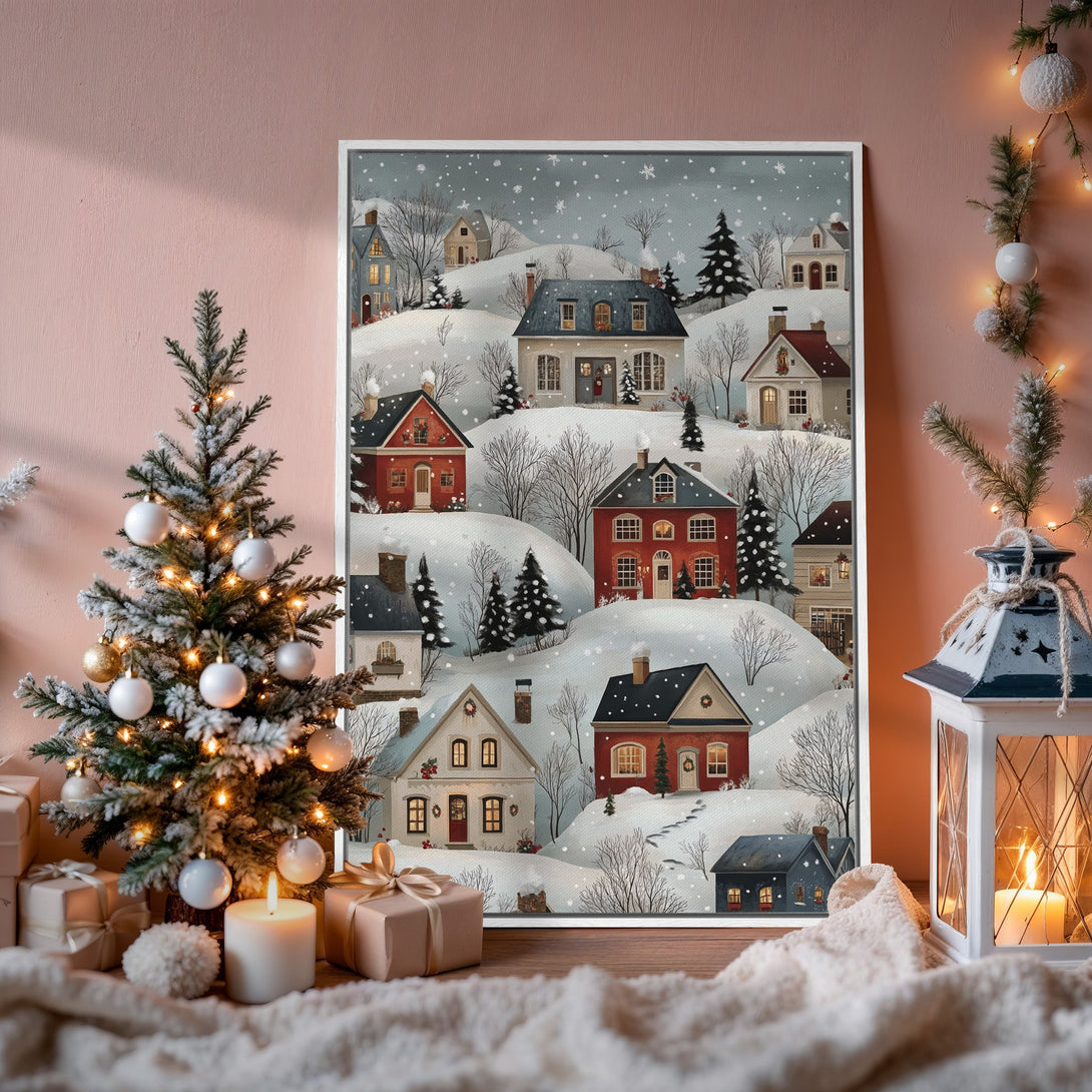 Framed Wall Art: Winter village scene in a cozy, whimsical style. Featuring a snowy landscape with red and white houses, perfect for holiday decor.