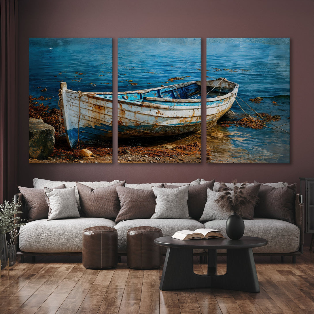 Canvas Print of a weathered boat on the shore, coastal art in blue and brown tones, perfect for a living room.