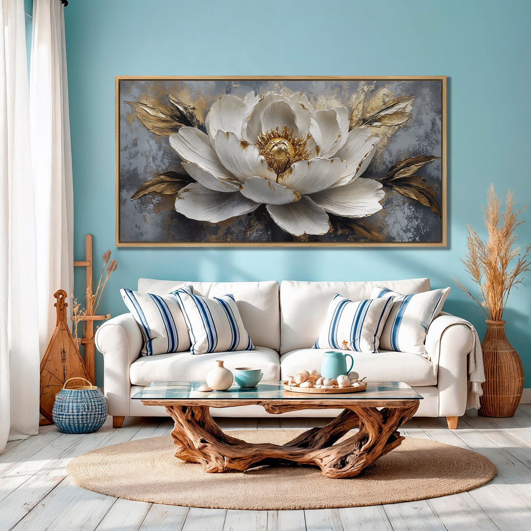 Framed Wall Art: Elegant white flower canvas print with gold accents. Coastal-inspired interior with a calming blue and neutral color palette. Perfect home decor.