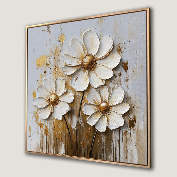 Framed Wall Art featuring textured white daisies with gold accents. Modern, abstract style with a neutral and gold color palette. Perfect for home decor.