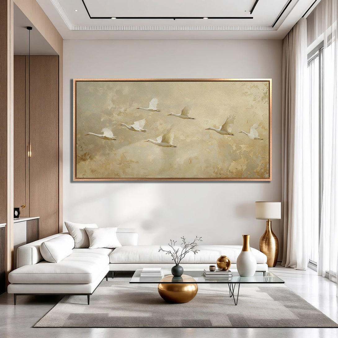 Framed Wall Art: Elegant painting of flying birds in a neutral color palette, perfect for adding a touch of sophistication to any living room.