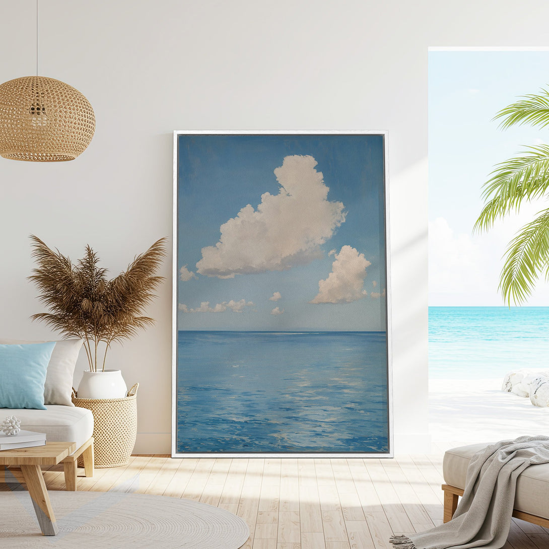 Framed Wall Art: Serene ocean and cloudscape canvas print in calming blue hues. Coastal art perfect for a relaxing living room or bedroom.