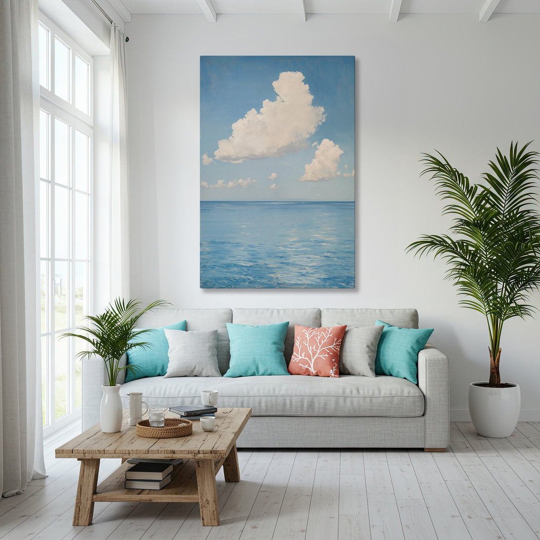 Framed Wall Art: Coastal seascape Canvas Print in a modern living room. Blue and white color palette, perfect for beach house decor.