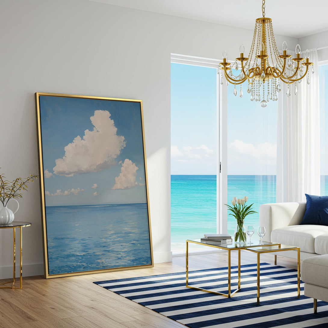 Canvas Print of serene ocean and sky artwork in a coastal-inspired living room. Blue, white, and teal color palette for a calming aesthetic.