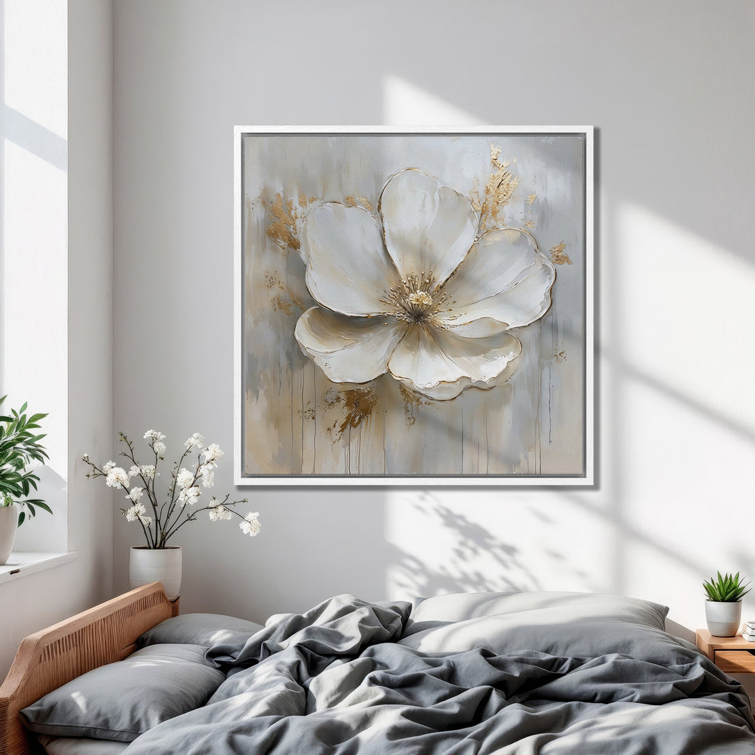 Framed Wall Art of a large white flower painting in a modern bedroom. Neutral color palette with gold accents. Elevate your space!