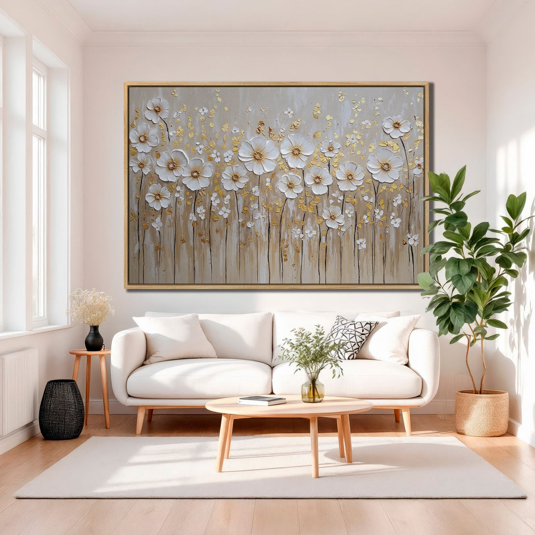 Framed Wall Art featuring white floral artwork with gold accents. Neutral color palette complements any decor. Elevate your space with this stunning Canvas Print!