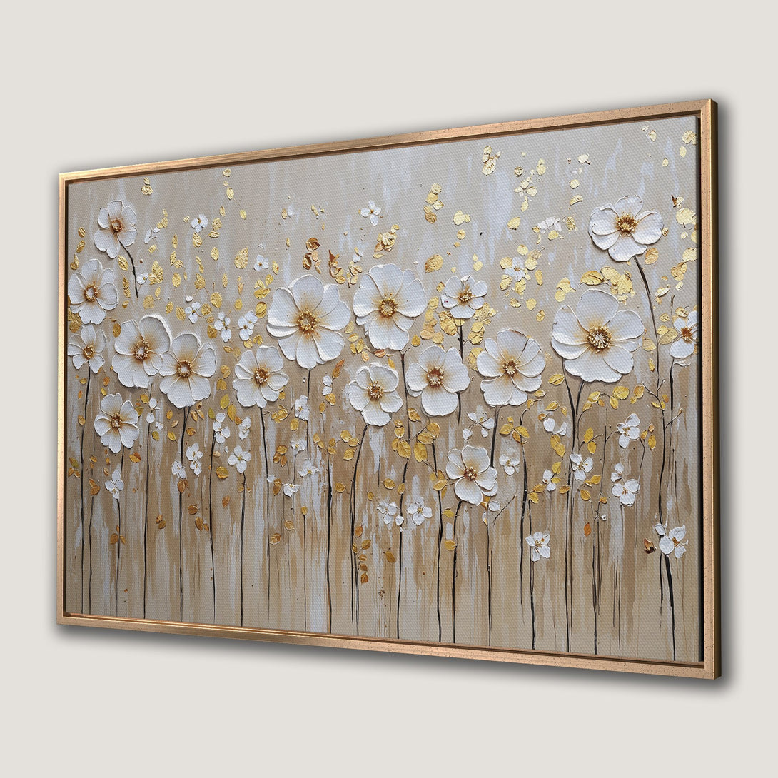 Framed Wall Art featuring textured white flowers with gold accents on a neutral background. Elegant floral art in a warm, inviting color palette.