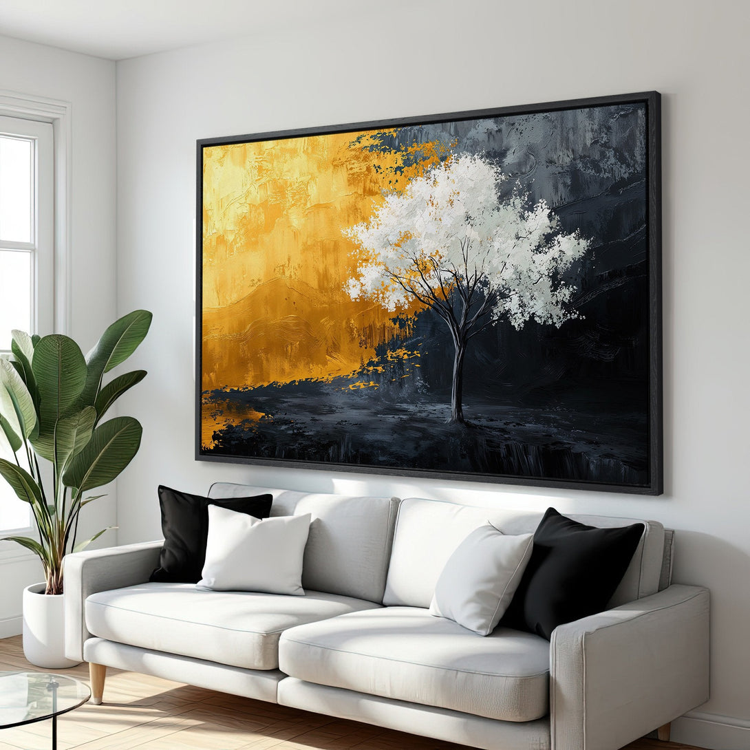 Framed Wall Art featuring an abstract tree painting with a gold, black, and white color palette. Modern art for a stylish living room.