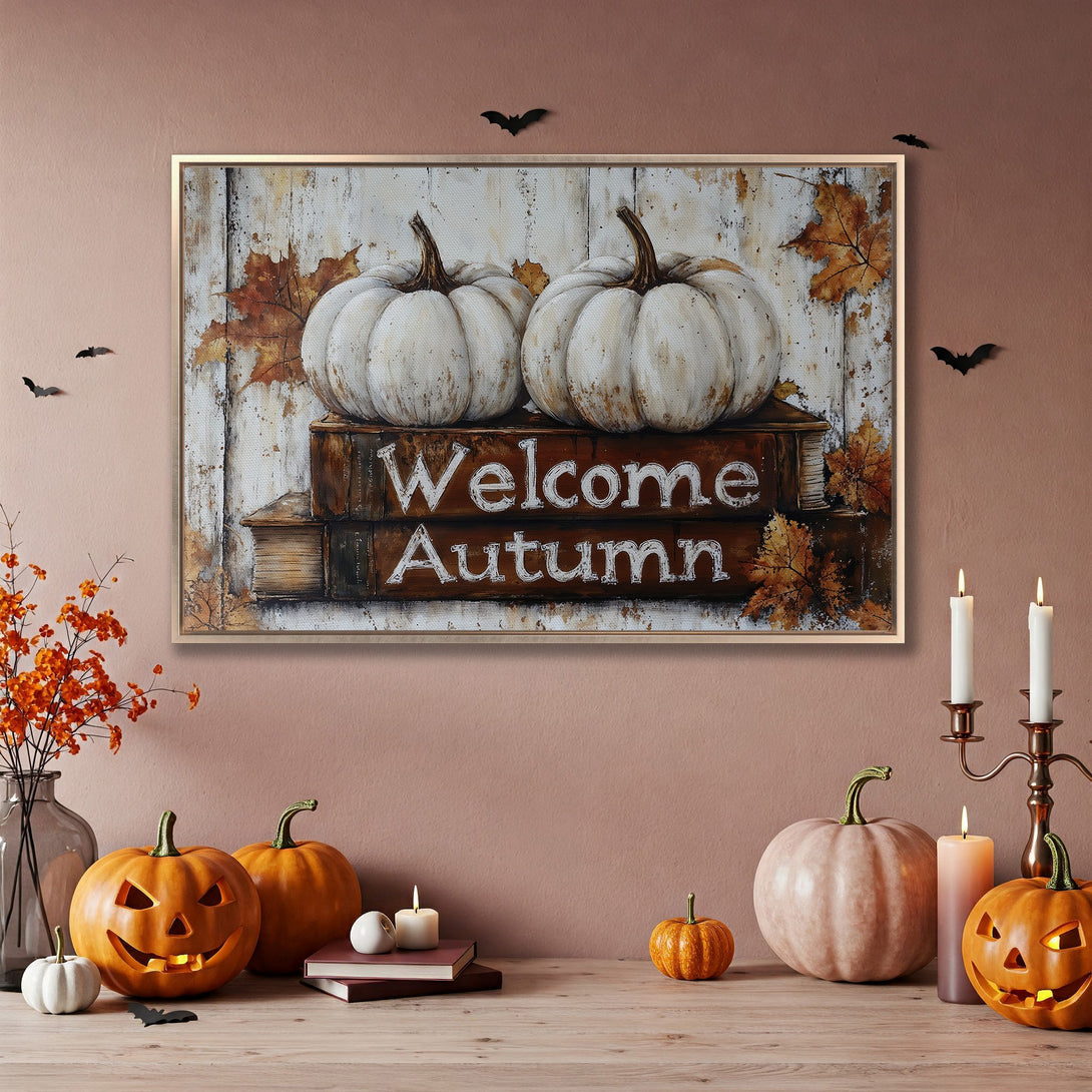 Framed Wall Art: "Welcome Autumn" Canvas Print with pumpkins and fall leaves. Warm, rustic color palette perfect for seasonal decor.