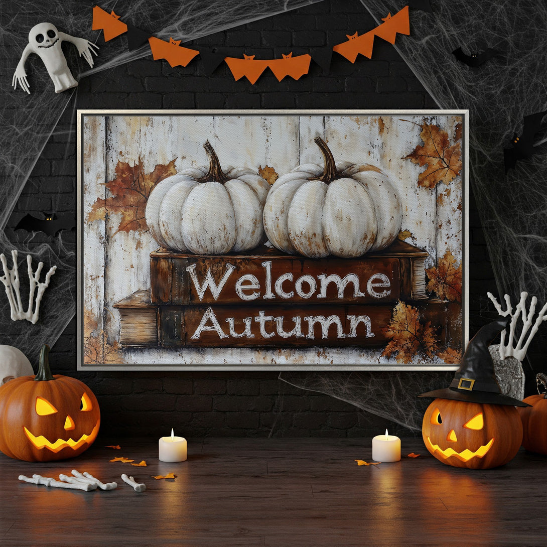 Framed Wall Art featuring white pumpkins and "Welcome Autumn" text. Rustic style with warm orange and brown autumn color palette. Perfect fall decor.