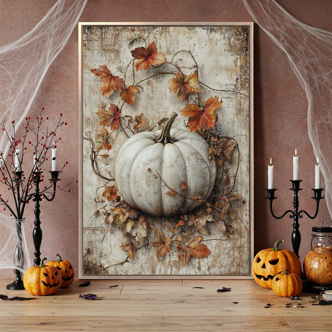 Framed Wall Art featuring a white pumpkin with autumn leaves, rustic style, warm brown & orange tones, perfect for Halloween decor.