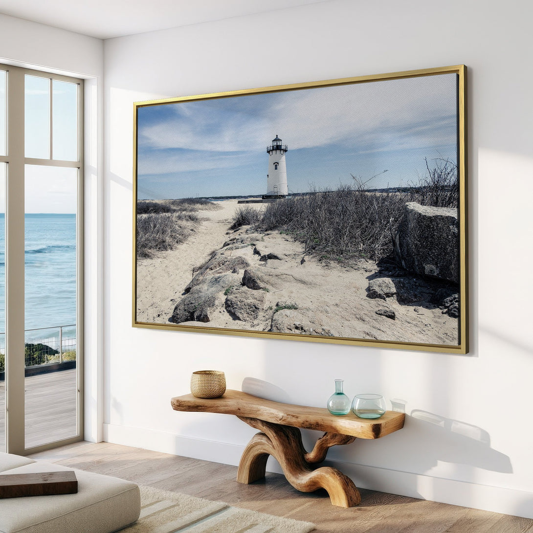 Canvas Print of a lighthouse on a sandy path. Coastal style art with neutral tones, perfect for adding a touch of serenity to any room.