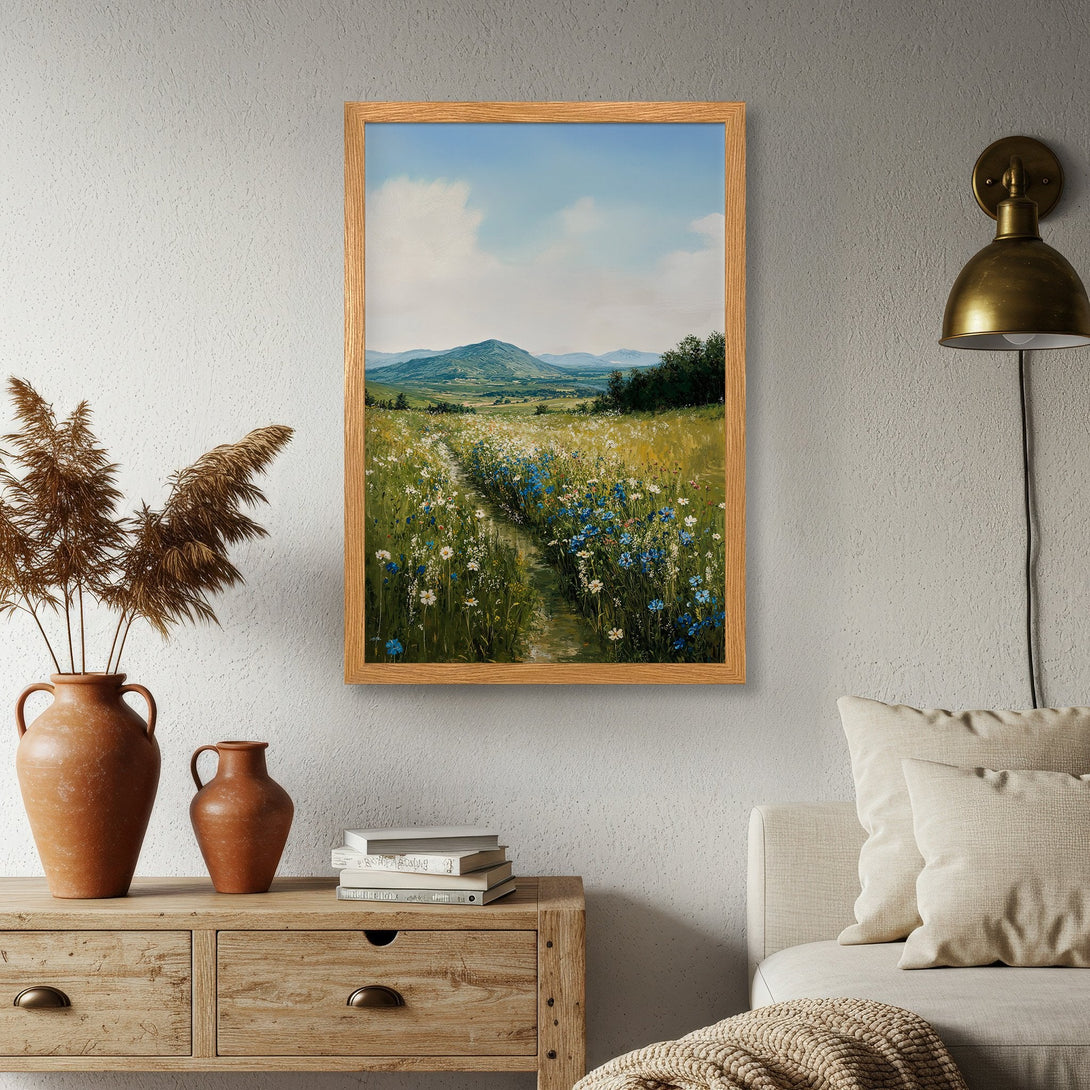 Framed Poster of a serene meadow landscape in a soft, impressionistic style with a green, blue, and yellow color palette. Add nature to your home!