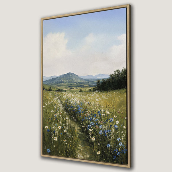 Framed Wall Art: Landscape Canvas Print featuring a field of wildflowers, mountains, and a blue sky. Earthy tones and a serene, impressionistic style.