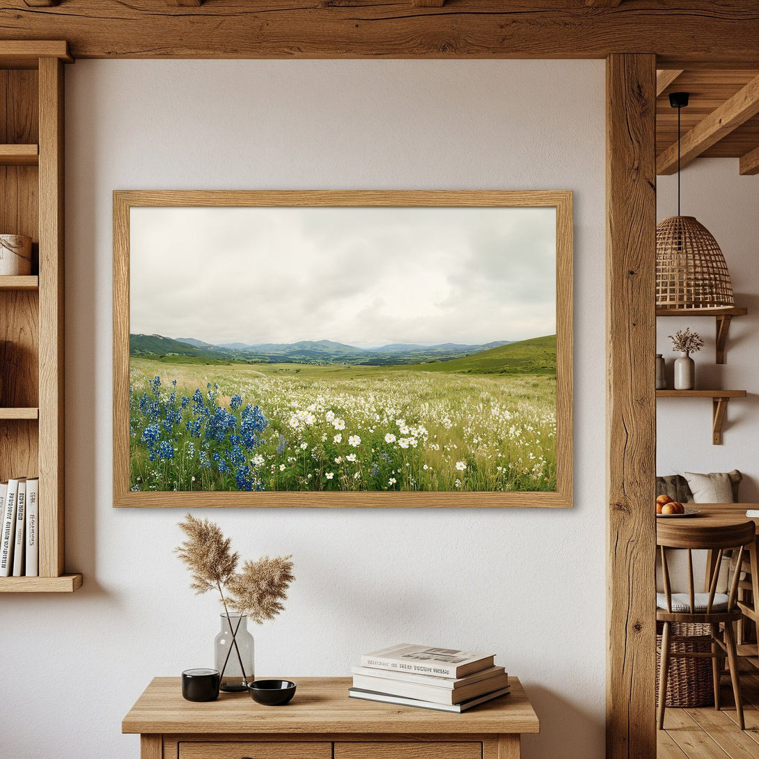 Framed Poster featuring a serene field of wildflowers. Rustic style with a natural green, blue, and cream color palette. Bring nature indoors!