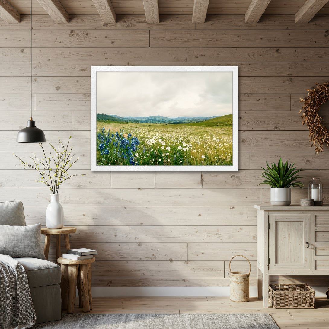 Framed Poster of a serene wildflower meadow. Rustic style, with a natural green, blue, and yellow color palette. Bring the outdoors in!