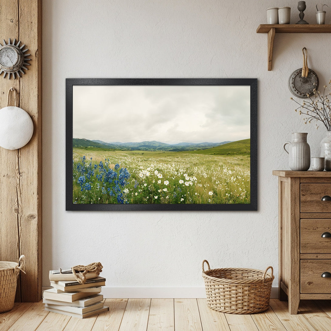 Framed Poster of wildflowers in a field, serene landscape art, soft green & blue color palette, perfect wall decor.