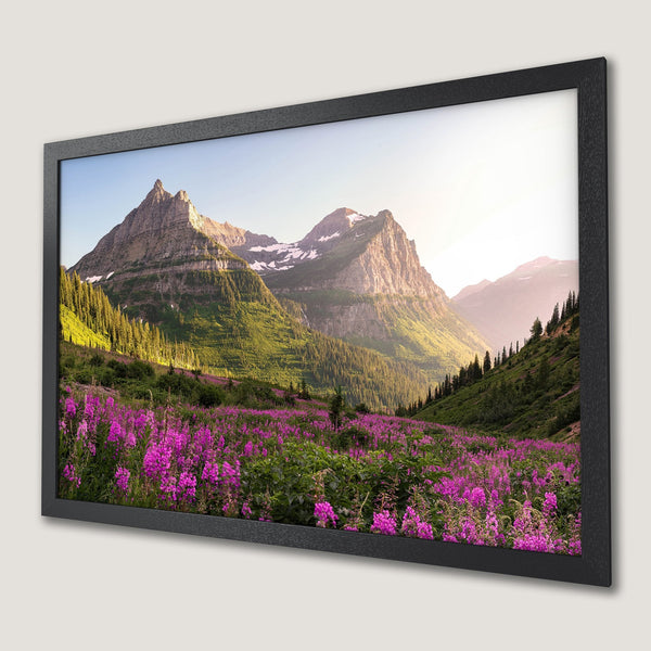 Framed Poster of mountain landscape with vibrant purple wildflowers. Nature art in green, pink, and blue tones.