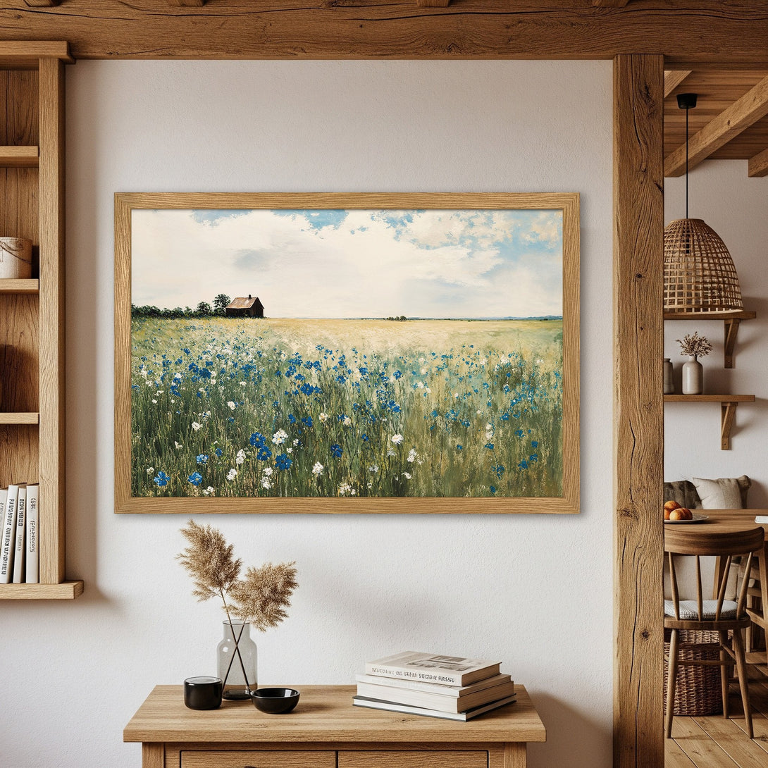 Framed Poster of a serene field with wildflowers, in a soft, impressionistic style. Earthy tones with blue and yellow accents.