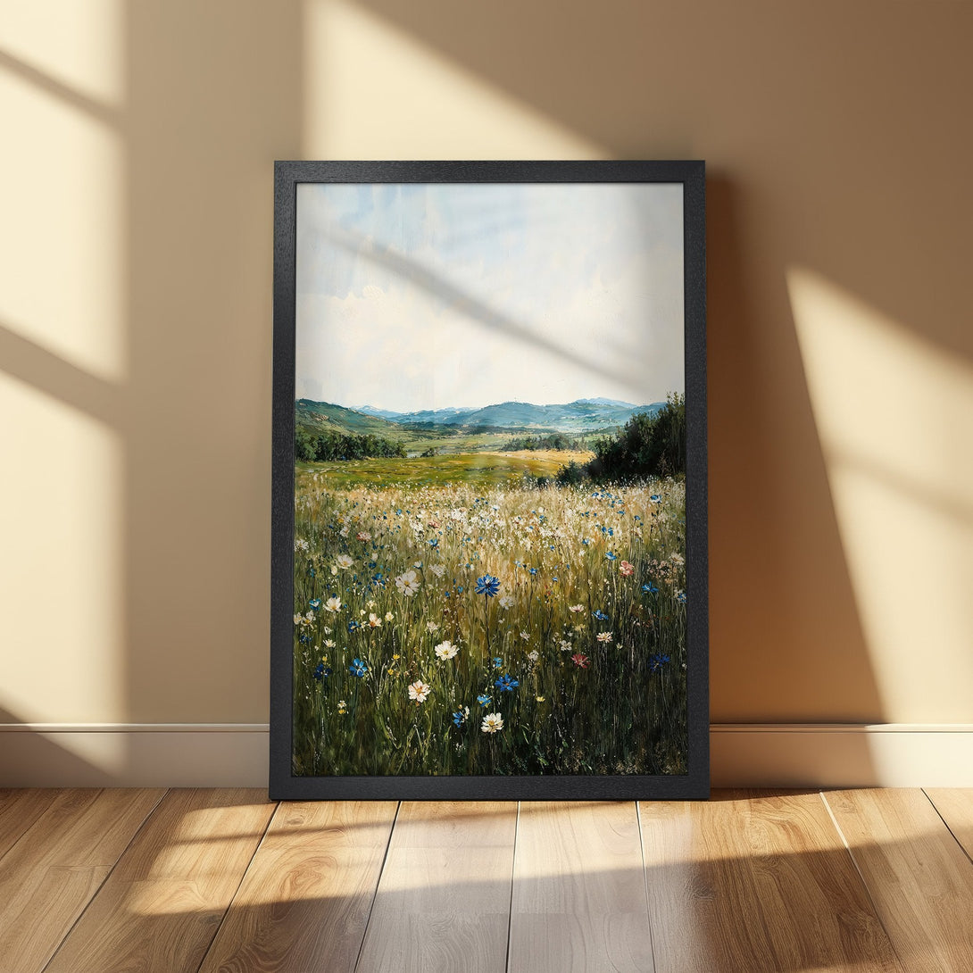 Framed Poster of a vibrant wildflower meadow painting in a natural style with green, blue, and yellow hues. Perfect wall art.