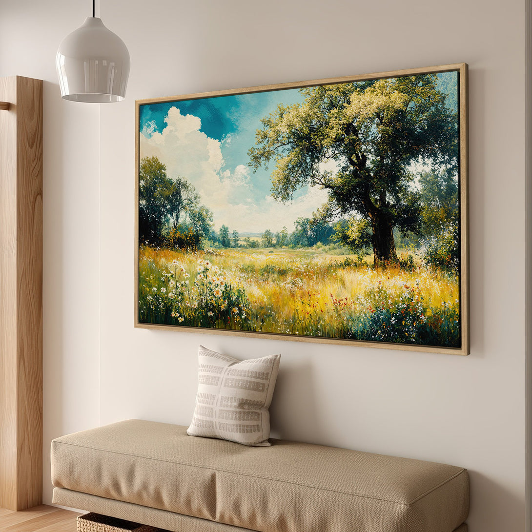 Framed Wall Art: Landscape Canvas Print featuring a vibrant meadow with a tree, in a warm, inviting color palette of greens, yellows, and blues.