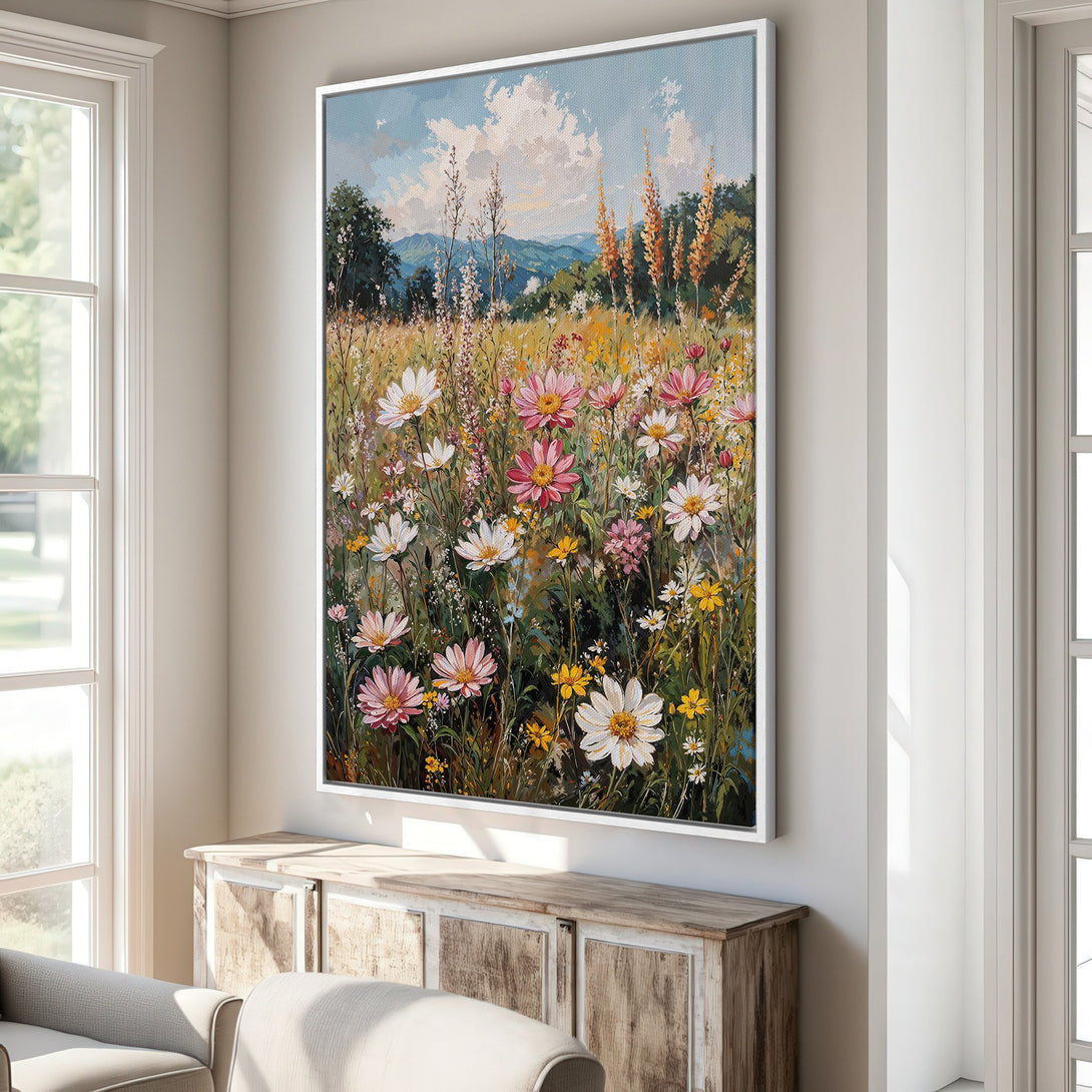 Framed Wall Art: Colorful wildflower meadow painting in a bright, airy interior. Features a vibrant palette of pink, yellow, and green, perfect for adding a touch of nature.