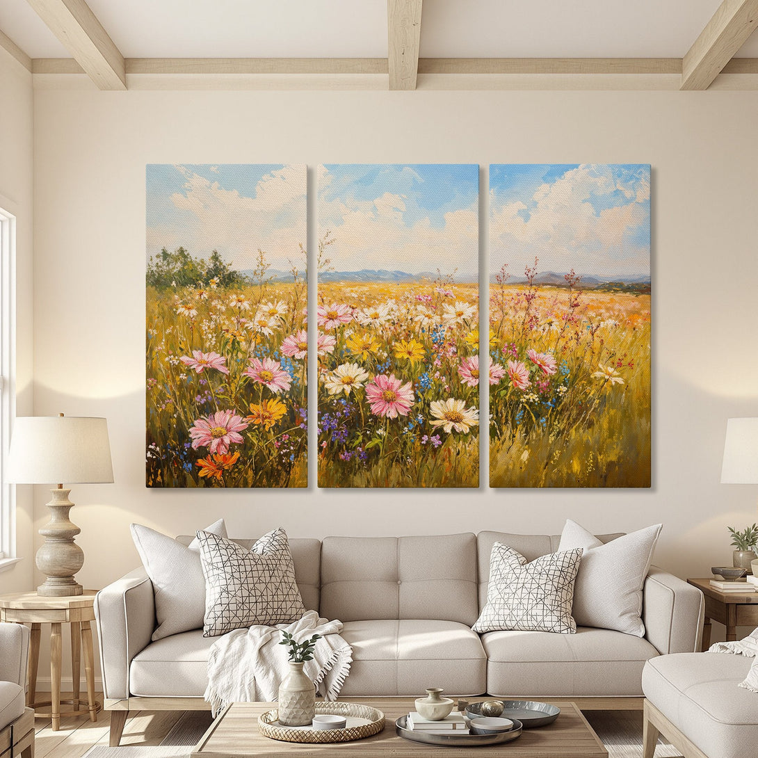 Canvas Print of a vibrant floral field painting in a warm, inviting living room. Features a colorful palette with pink, yellow, and blue hues.