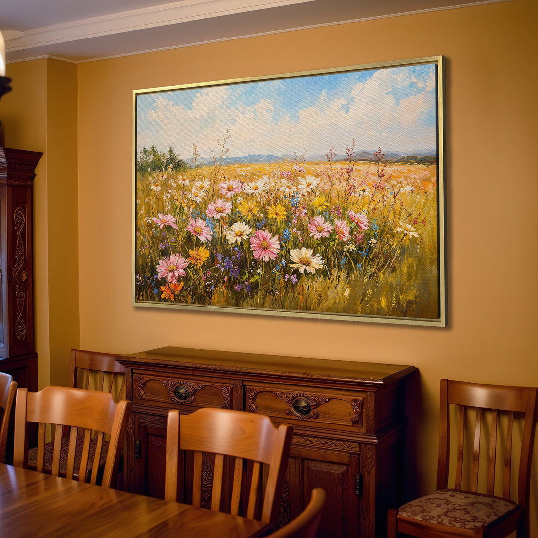 Canvas Print of a vibrant wildflower field painting in a warm, inviting living room. Featuring a colorful palette of blues, pinks, yellows, and greens.