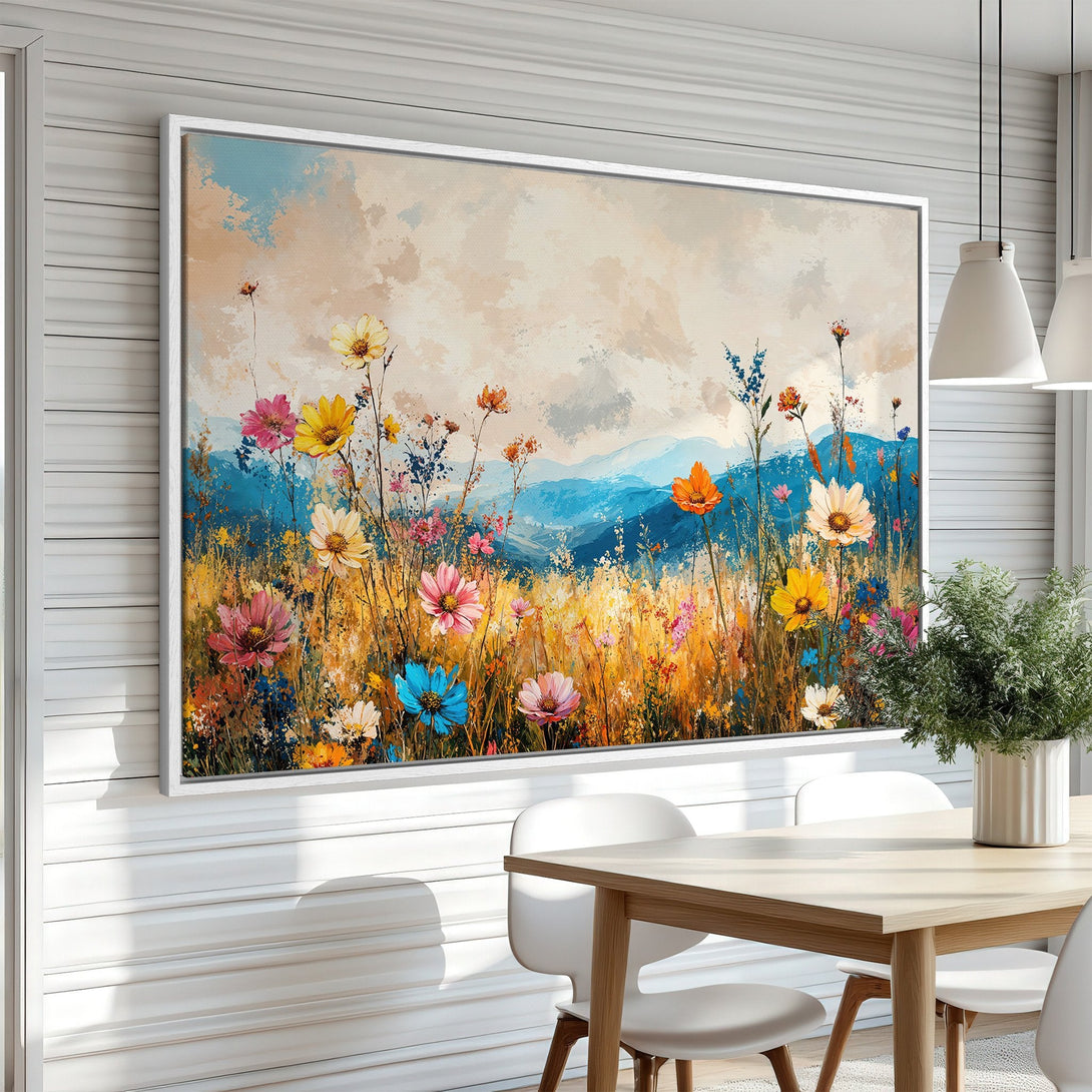 Framed Wall Art: Vibrant floral field canvas print with a colorful palette of blues, yellows, pinks, and oranges. Perfect for adding a touch of nature.