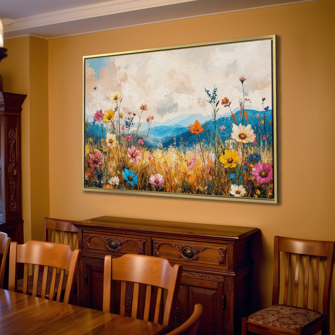Canvas Print of a vibrant wildflower landscape painting in a cozy living room. Features colorful flowers, blue mountains, and a warm, inviting palette.