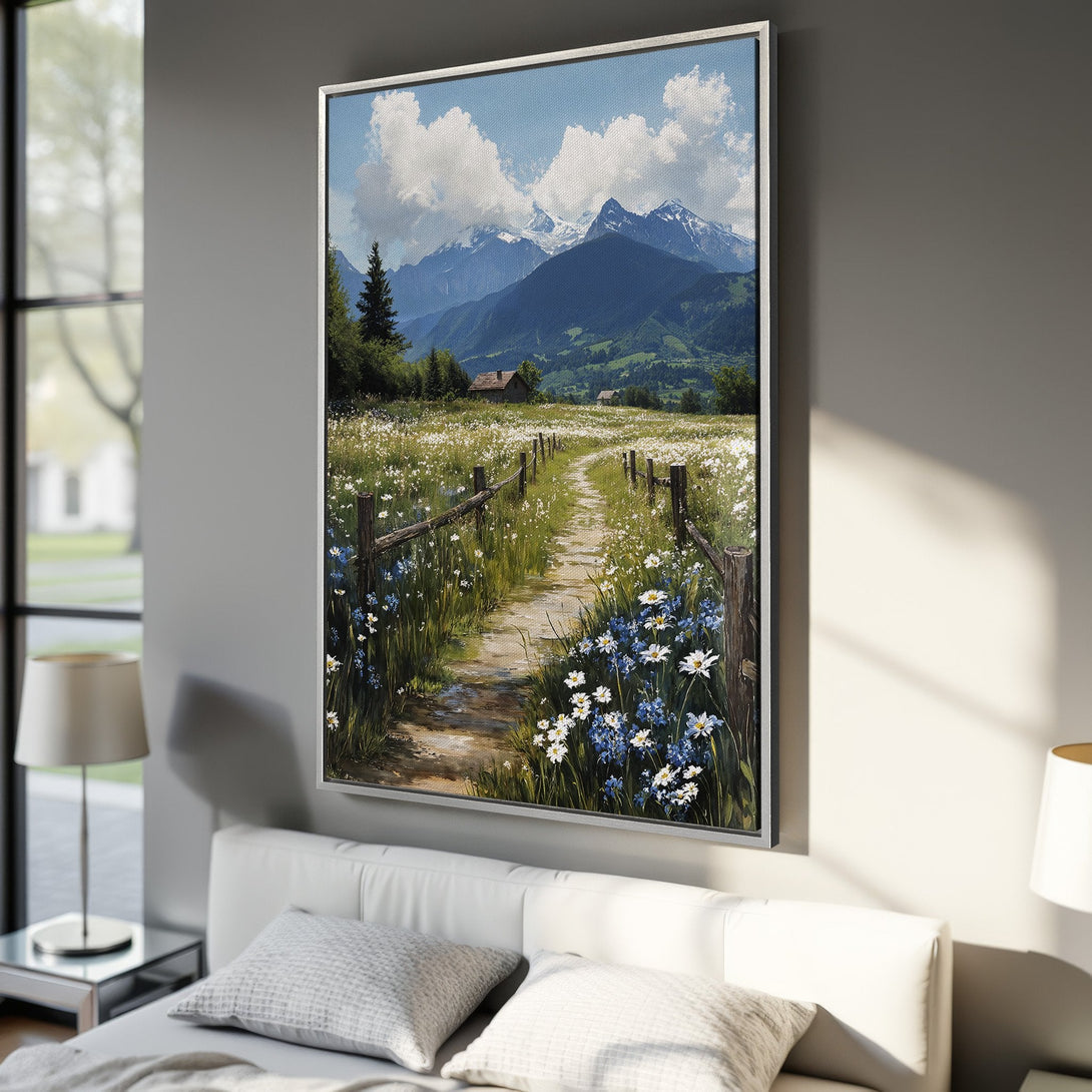 Framed Wall Art: Mountain landscape canvas print with a path through a field of flowers. Features a serene blue, green, and white color palette. Perfect for home decor.