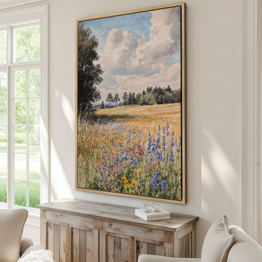 Framed Wall Art: Watercolor landscape Canvas Print with a field of wildflowers, featuring a blue, yellow, and green color palette, perfect for adding a touch of nature.
