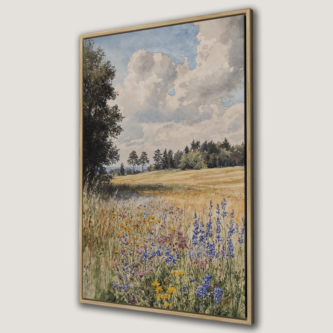 Framed Wall Art featuring a watercolor landscape of a field with wildflowers. Soft blues, yellows, and greens create a serene, natural scene.