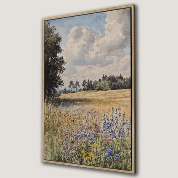 Framed Wall Art featuring a watercolor landscape of a field with wildflowers. Soft blues, yellows, and greens create a serene, natural scene.