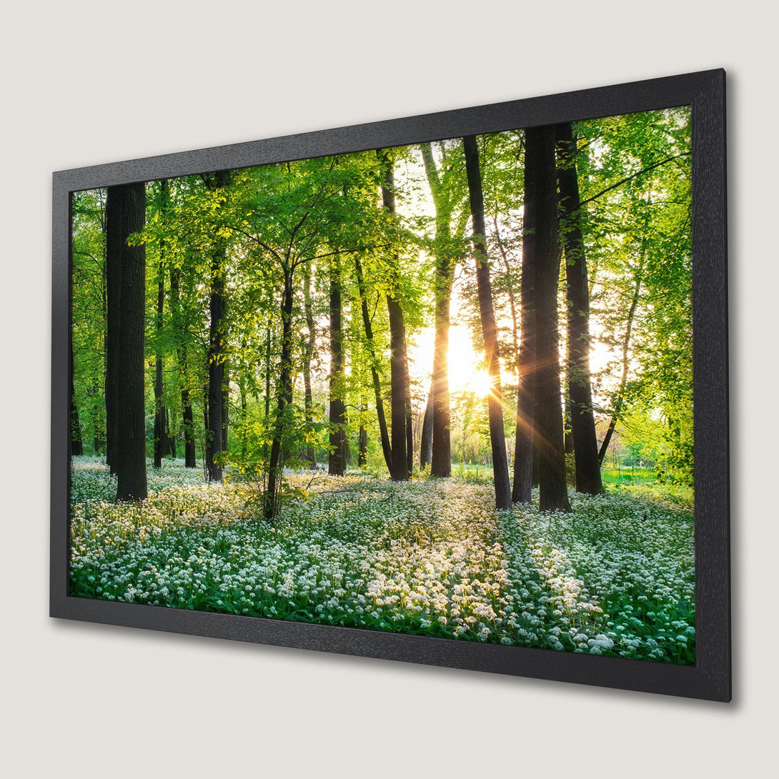 Framed Poster of a vibrant forest scene with green and white hues, perfect for nature lovers.