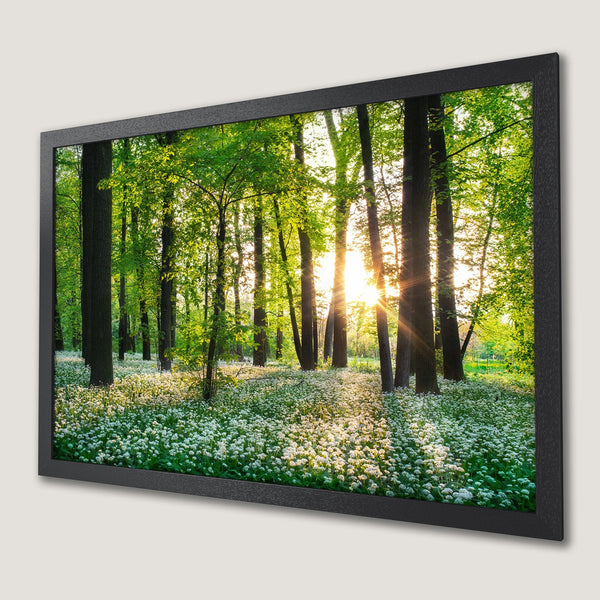 Framed Poster of a vibrant forest scene with green and white hues, perfect for nature lovers.