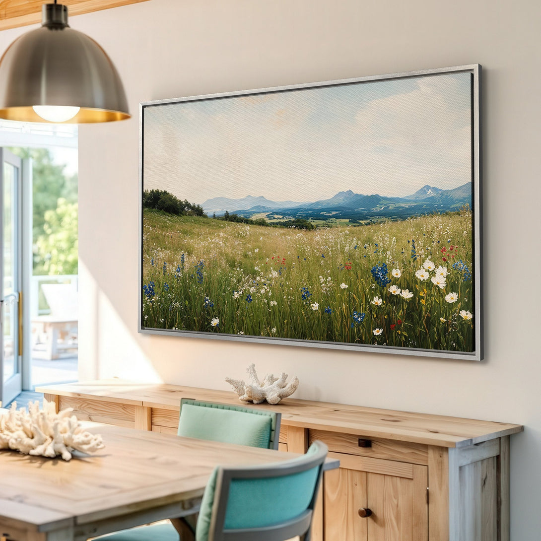 Framed Wall Art: Landscape Canvas Print with wildflowers, mountains, and a serene color palette of greens, blues, and beige. Perfect for home decor.