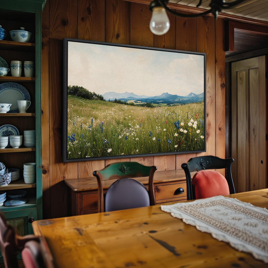 Framed Wall Art: Landscape Canvas Print in a rustic dining room. Features a meadow scene with wildflowers in a soft, natural color palette. Perfect home decor!