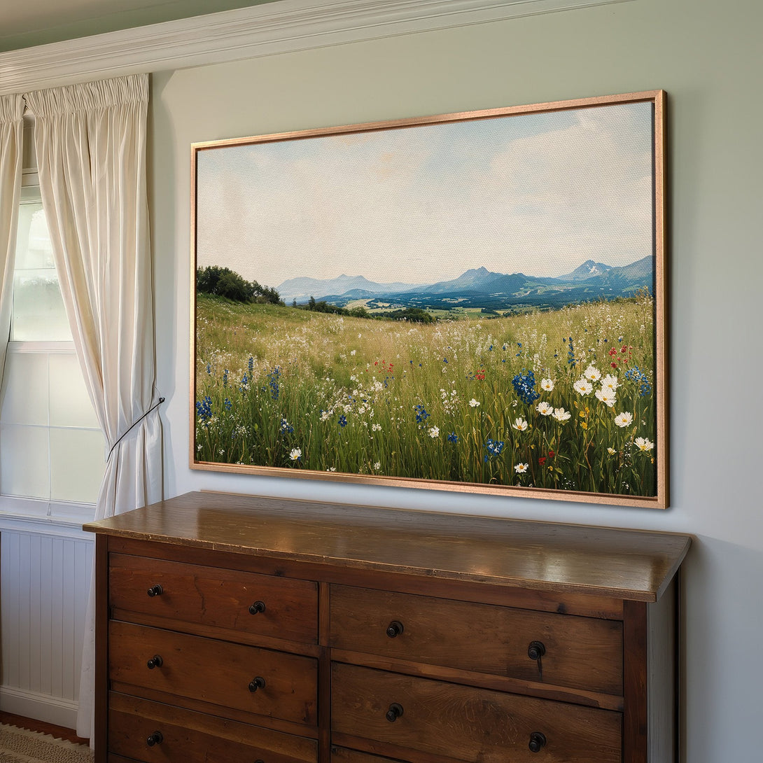 Framed Wall Art: Landscape Canvas Print with wildflowers & mountains. Earthy tones with pops of blue & white, perfect for adding a touch of nature.