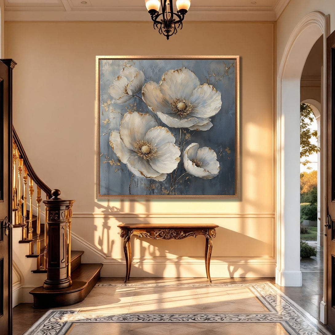 Framed Wall Art: Elegant floral Canvas Print in a luxurious interior. Features white flowers on a blue background, gold accents, and a neutral color palette.