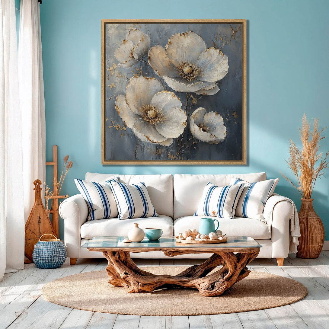 Framed Wall Art featuring elegant white floral art on a gray background. Coastal decor with a blue and gold color palette, perfect for a living room.