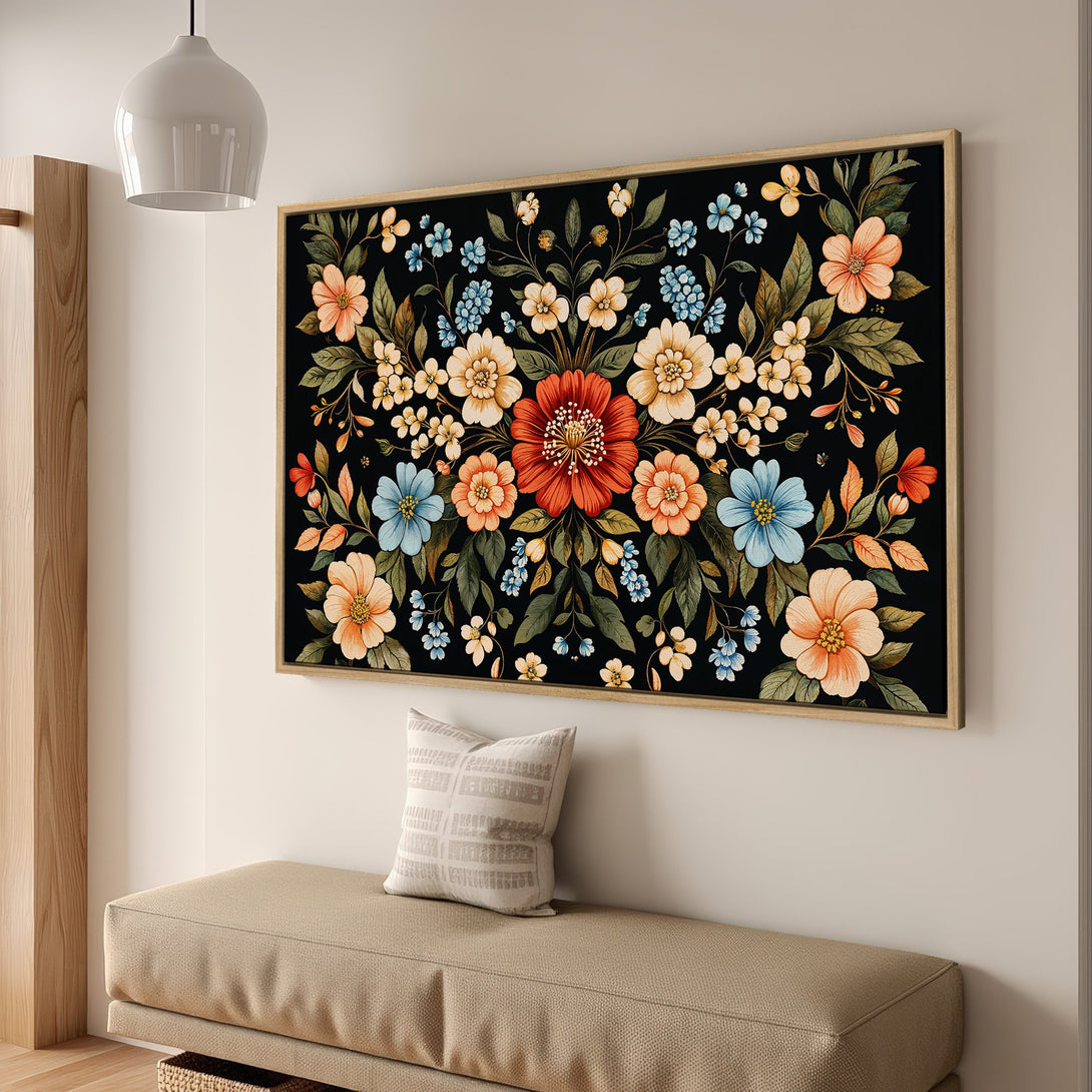 Framed Wall Art featuring a vibrant floral design on a black background. Warm color palette with orange, blue, and cream flowers. Perfect for adding a pop of color.