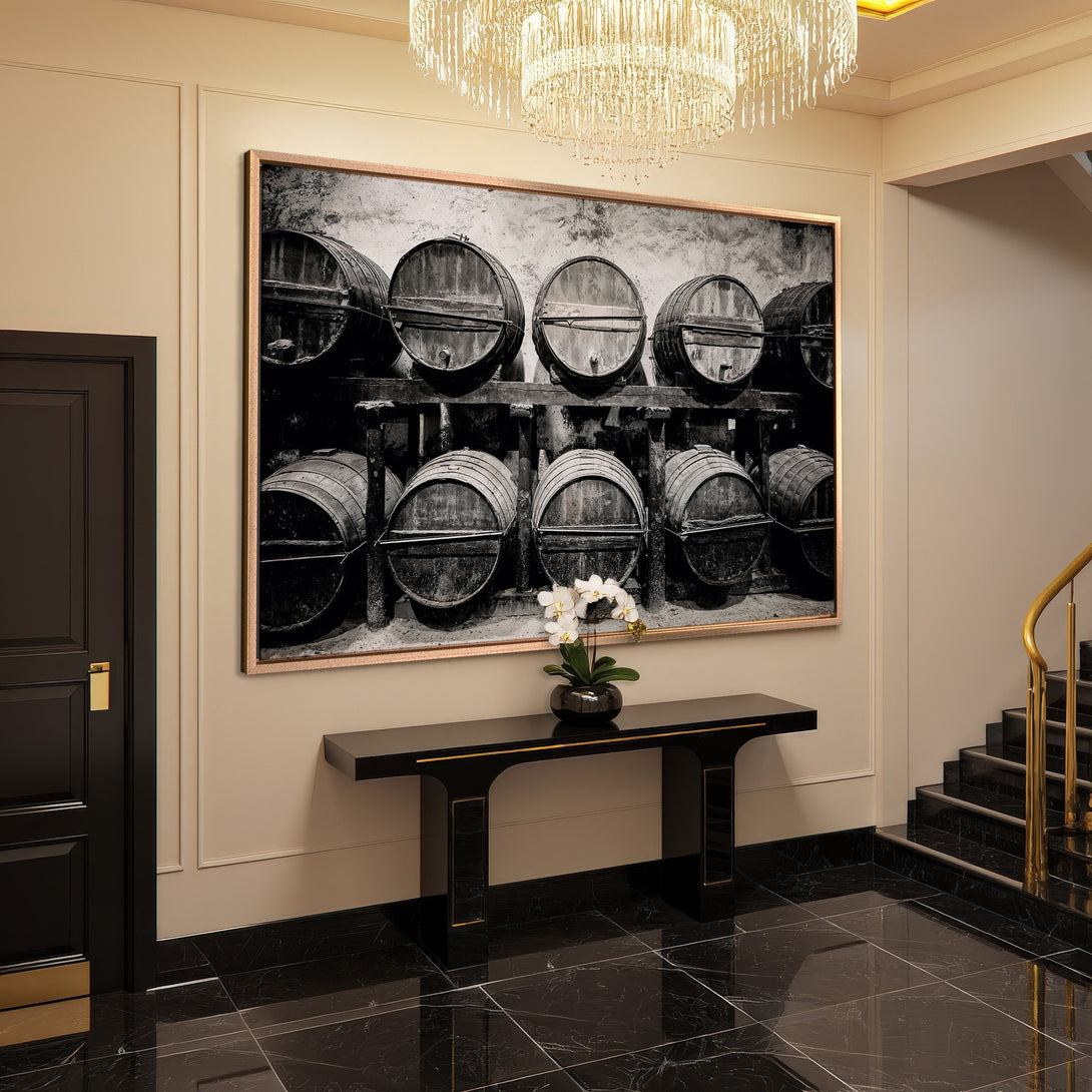 Framed Wall Art of wine barrels in a cellar, black and white photography, adding elegance to a luxury interior.