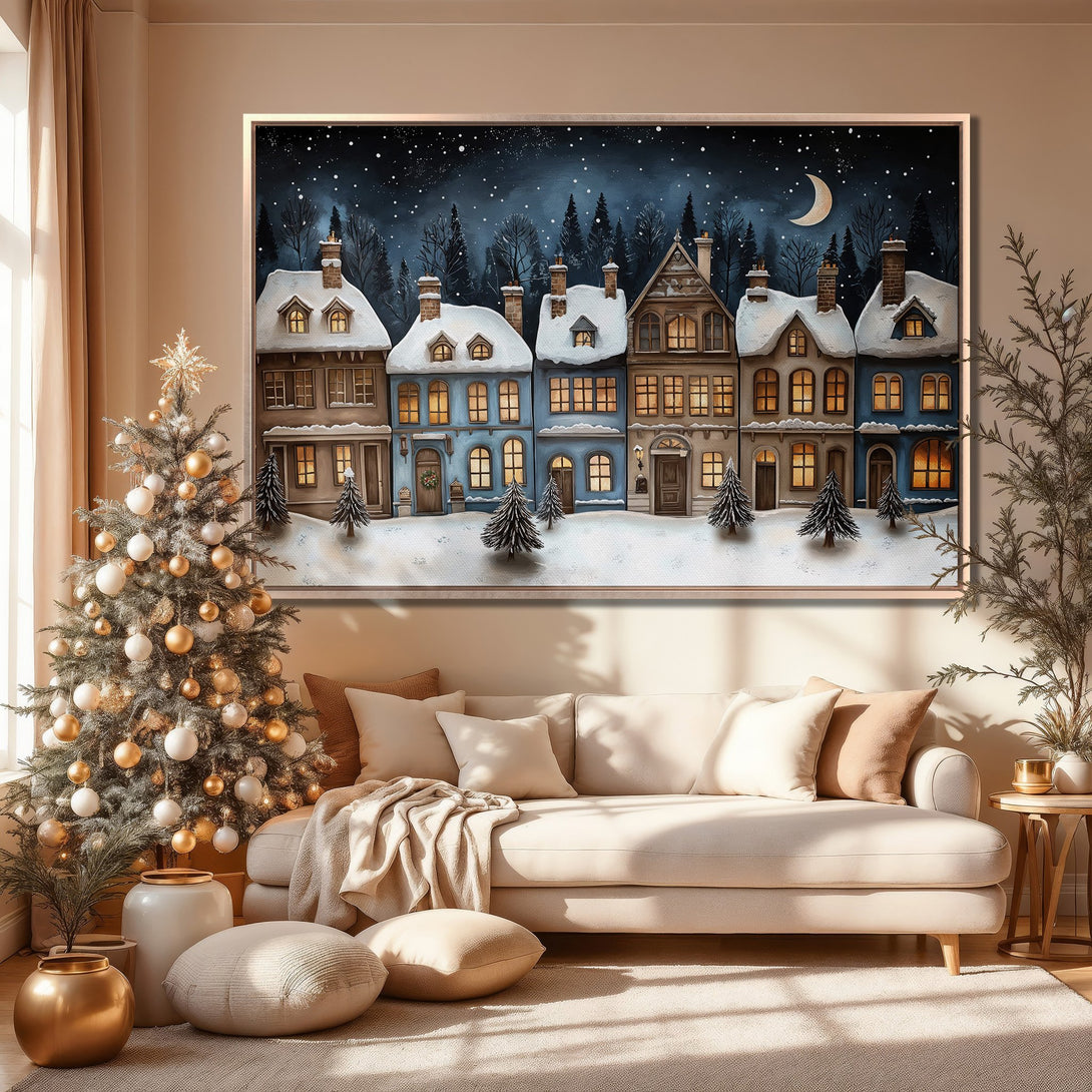 Framed Wall Art showcasing a winter village scene in a cozy living room. Featuring a blue and neutral color palette, perfect for holiday decor.