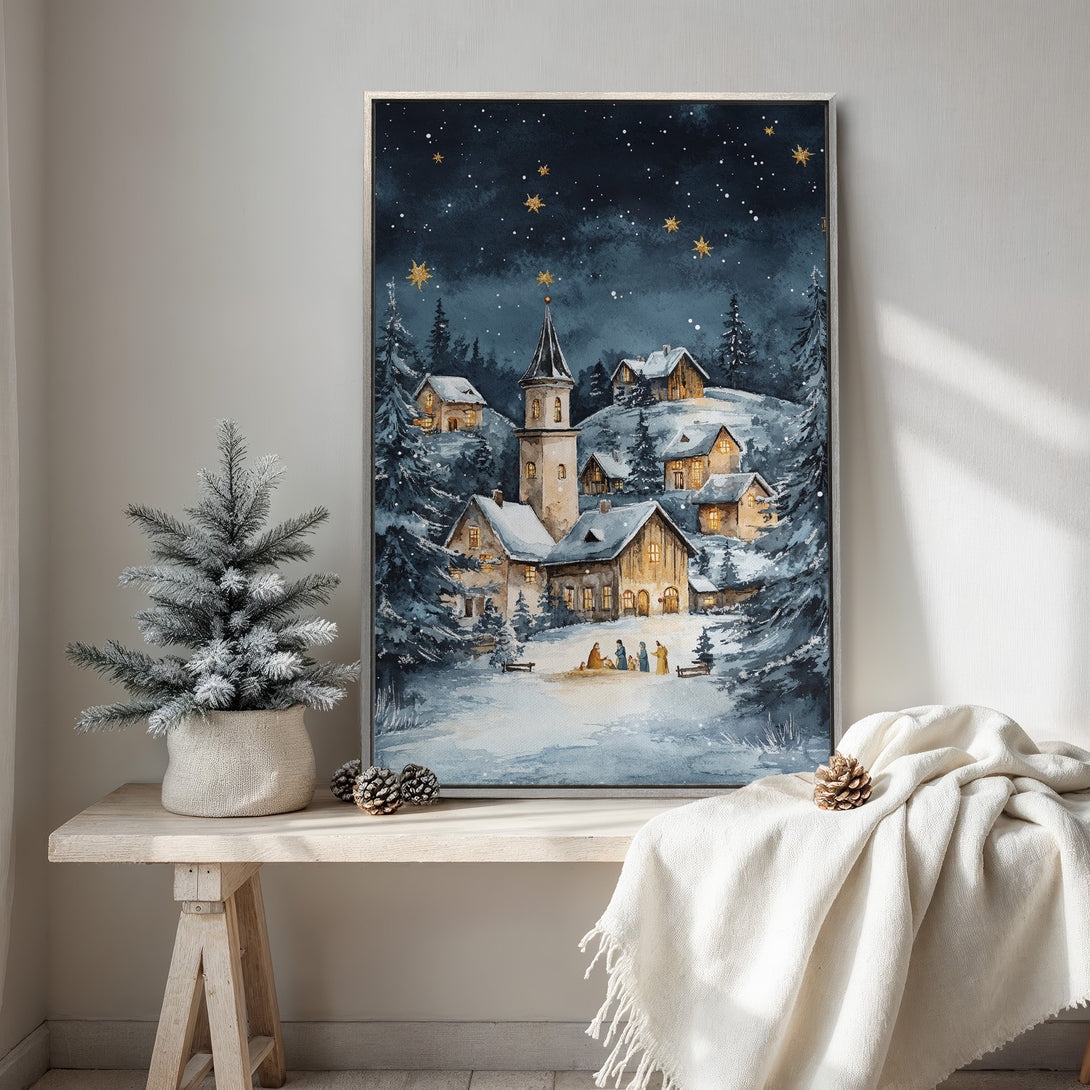 Framed Wall Art featuring a winter village scene in watercolor style. Blue and gold color palette creates a cozy, festive atmosphere. Perfect holiday decor!
