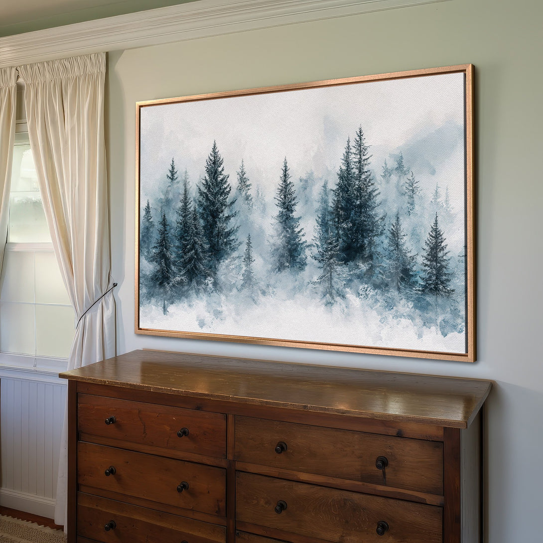 Framed Wall Art featuring a serene watercolor forest scene in blue and white hues. Perfect for adding a touch of nature to your home decor.